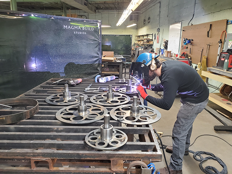 welding metal at Magma Build Studios in Baltimore